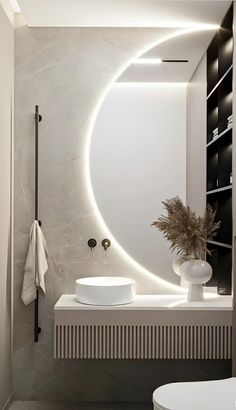 a white sink sitting under a mirror in a bathroom