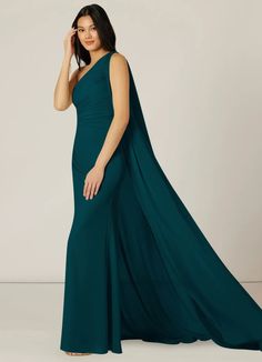 a woman in a long green dress