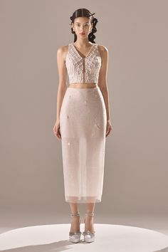 Elevate your presence with our skirt. Designed to complement your figure and crafted with intricate sequin detailing, this skirt will be a statement piece in your wardrobe. The mesh fabric adds a touch of allure, making it perfect for any special occasion. * Note: Include a belt if you buy full set (jacket, crop top, skirt). Luxury White Evening Skirt, Luxury Chic Sheer Skirt, White Bodycon Skirt, Luxury White Skirt With Floral Embroidery, Luxury White Lace Skirt, Spandex Crop Top, Bodycon Skirt Outfit, Luxury White Asymmetrical Maxi Skirt, Jacket Crop