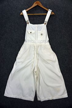 Orslow Japan used bib overalls for sale. - 8/10 good condition. - Made in Japan. - 100% cotton. - US size XXS on the tag. - Will fit up to 30 inches waist. - The actual color may a bit different from the pictures. - A few defects. - Signs of wear. - Good in shape. - Please refer to the pictures and measurements. - Measurements (approximately): Waist - up to 30 inches Laying flat: Inseam - 17.5 inches Length - 30 inches Front Rise - 14.5 inches Hip - 23 inches Top Thigh - 15.5 inches Leg Opening Utility Wide-leg Overalls With Pockets, Vintage Bib Front Overalls With Pockets, Vintage Full-length Cotton Overalls, Cotton Full-length Relaxed Fit Overalls, Vintage Cotton Bib Front Jumpsuit/romper, Womens Overalls, Bib Overalls, Overalls Women, Best Jeans