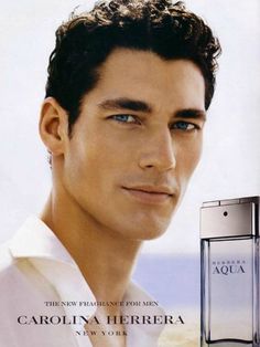 an advertisement for the new perfume, featuring a man with dark hair and blue eyes