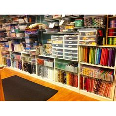 a room filled with lots of craft supplies