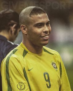 a soccer player is smiling for the camera