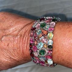 On a Customer’s hand this stunning custom tourmaline diamond bracelet. Call text or studio at +1-714-924-2732 Unique Multicolor Gemstones For Formal Occasions, Multicolor Gemstones For Formal Occasions, Luxury Multicolor Bracelets With Stones, Luxury Multicolor Stone Bracelets, Unique Multi-stone Bangle Bracelets, Luxury Multicolor Jeweled Bracelets, Luxury Multicolor Gemstones, Elegant Multicolor Tourmaline Jewelry, Multicolor Tourmaline Gemstones For Fine Jewelry