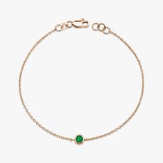 Our simple and elegant solitaire bracelet features a round cut natural emerald at its center. We can craft this bracelet in 14K or 18K Gold according to your preference.★ Bracelet Features• Gold Kt: 14K/18K Solid Gold (All pieces are stamped for authenticity)• Available Gold Colors: Yellow Gold, Rose Gold, White Gold• Center Round Cut Emerald Weight: 0.12 carat• We only work with real natural emeralds• We offer a signed certificate with each bracelet for the authenticity of the center emerald st Elegant Round Emerald Bracelet, Emerald Yellow Gold Bracelet For Gift, Classic Gold Bracelets With Emerald, Hypoallergenic Emerald Bracelet Jewelry, Adjustable Green Emerald Bracelet, Diamond Stacking Rings Engagement, Solitaire Bracelet, Diamond Huggies, Emerald Bracelet