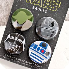 three star wars badges are shown in front of a book with the title, set of 4 handmade badges for young children to share