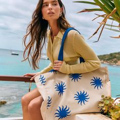 Be the ultimate goddess with BURGA's Beach Bag. Imagine strutting down the beach, bag in hand, catching everyone's eye with its vibrant patterns and luxe look. It's roomy enough to fit all your essentials (and then some), but sleek enough to make a fashion statement. Whether you're hitting up a tropical paradise or just lounging by the pool, this bag screams style, sass, and totally you.    Features:     Dimensions: 50 x 11 x 35 cm (19.7 x 4.4 x 13.8 inches)     Made from durable canvas: 35% cotton and 65% polyester.     Secured with magnetic fasteners.     Interior pocket for phone, keys, and small items.     Spacious design for all your essentials.     Part of our exclusive Resort Collection.     Care Instructions:     Spot clean with mild soap and water.     Hand wash with cold water an Sand-colored Travel Bags For Beach Season, Sand-colored Shoulder Bag For Summer Travel, Chic Summer Beach Canvas Bag, Summer Canvas Bag With Double Handle, Trendy Beach Bag With Double Handle For Day Out, Summer Canvas Bag With Double Handle For Beach, Trendy Double Handle Beach Bag For Day Out, Trendy Bags For Day Out In Beach Season, Trendy Bags For Beach Season Day Out