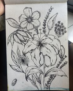 a black and white drawing of flowers on paper