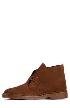 An iconic silhouette elevates a timeless boot set on a smart crepe rubber sole. Cushioned arch support Lace-up style Leather upper/textile lining/rubber sole Imported Classic High-top Suede Desert Boots, Classic High-top Chukka Boots With Stitched Sole, Classic High-top Boots With Suede Lining, Brown Chukka Boots For Fall With Branded Insole, Classic Moc Toe Desert Boots For Fall, Classic Lace-up Desert Boots With Suede Lining, Classic Desert Boots With Suede Lining And Moc Toe, Classic Desert Boots With Leather Footbed And Moc Toe, Classic Moc Toe Desert Boots With Textured Sole