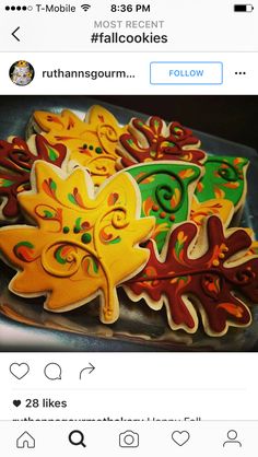 an image of some decorated cookies on top of a tray with the caption follow us