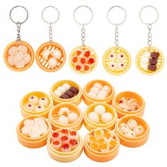 an assortment of different types of food in small containers with keychains on them