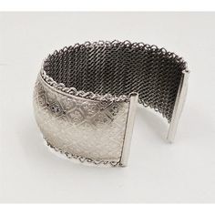 This is part of Chairish’s Costume Jewelry assortment.  1960s rhodium plated fleur de lis cuff bracelet. Marked "Jewels by Julio." Measures:  2 1/4 inches wide by 1 3/16 inches tall by 2 inches deep. Condition: Very good; some minor surface wear towards the back and to the signature. Harder to see in person than in the photos. Elegant Wide Band Metal Cuff Bracelet, Silver Metal Cuff Bangle, Silver Wide Band Metal Bracelet, Elegant Engraved Antique Silver Cuff Bracelet, Silver Wide Band Cuff Bracelet For Formal Occasions, Silver Wide Band Metal Bangle, Silver Vintage Cuff Bracelet For Formal Occasions, Antique Silver Adjustable Cuff Bracelet For Formal Occasions, Silver Metal Cuff Bracelet With Intricate Design