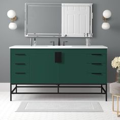 a bathroom vanity with two sinks and a large mirror above it, in front of a gray wall