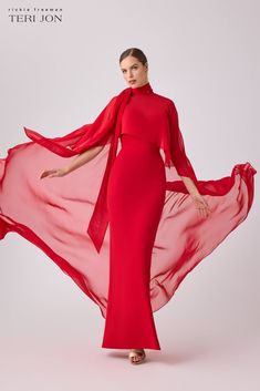 Transform any occasion into a moment of sheer elegance with our crepe slip cape gown-a masterpiece of contemporary couture. This stretch slip dress features a sleek and elegant silhouette, while the chiffon cape overlay adds a touch of drama to the ensemble. Draping from the front to the back, the chiffon cape creates Red Carpet Affair, Chiffon Cape, Cape Gown, Gala Events, Lady Fashion, Formal Style, Mother Of The Groom, Mother Of The Bride Dresses, Dusty Blue