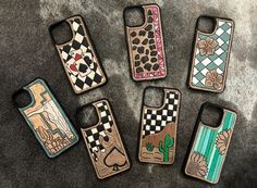 six cell phones with designs on them sitting next to each other in the shape of animals