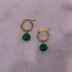 Materials: Stainless steel gold-plated hoop earrings, green onyx.  Sizing + Fit: 15mm hoops. Jade Hoop Earrings As Gift, Hypoallergenic Gold Plated Green Jewelry, Hypoallergenic Green Gold-plated Jewelry, Green Tarnish-resistant Huggie Jewelry, Green Nickel-free Huggie Earrings, Gold Jade Hoop Jewelry, Green Jade Hoop Earrings, Green Round Huggie Earrings For Pierced Ears, Green Round Huggie Earrings