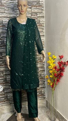 This green sequin straight kurta is made from designer sequin fabric which is eye catching in its look. This is kurta plazzo set .it is paired up with silk plazzo . Both the kurta and pants will have lining inside. We will collect your measurements as soon as the outfit is booked. Please feel free to contact us on etsy convo for further queries. Thank you Bollywood Style Sequined Straight Kurta, Bollywood Style Straight Kurta With Sequins, Festive Straight Kurta With Sequins, Festive Sequined Straight Kurta, Festive Sequins Straight Kurta, Semi-stitched Sequin Straight Kurta, Designer Sequined Straight Kurta, Semi-stitched Straight Kurta With Sequins, Eid Sequin Sharara With Straight Kurta