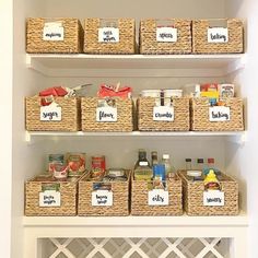 the pantry shelves are organized with baskets and labels