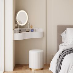 a white bed sitting next to a round mirror