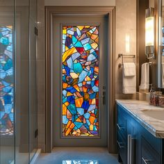 a bathroom with a large stained glass door