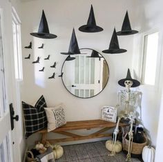 a hallway decorated for halloween with black and white decorations