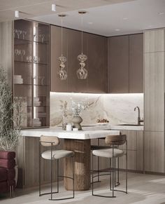 a kitchen with marble counter tops and stools