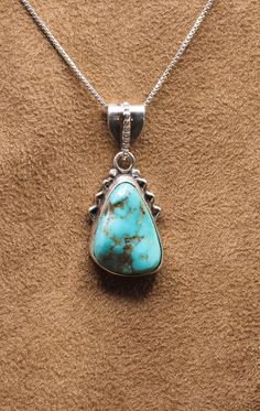 Beautiful Turquoise Pendant with 18" Sterling Silver Chain Top:  17 mm x 40 mm; 3/4" x 1-3/4" Weight:  7.5 Grams 925  Sterling Silver, Handmade $95 Exclusively Designed by Richard James for Richlo Jewelry Check out our other fine jewelry at:  https://etsy.com/shop/arizonagemstudio You need Turquoise in your life because it's a purification stone. It will effectively dispel negative energies and protect you against pollutants or negative outside influences. It will act like a spiritual balm to your heart and mind, which has been deeply affected by emotional wounds and emotional stress. Turquoise Sterling Silver Necklace, Turquoise Necklace With Sterling Silver Clasp, Turquoise Sterling Silver Necklace Stamped 925, Turquoise Sterling Silver Necklaces Stamped 925, Sterling Silver Turquoise Necklace Stamped 925, Sterling Silver Turquoise Necklaces Stamped 925, Untreated Turquoise Sterling Silver Necklace, Sterling Silver Turquoise Jewelry With Lobster Clasp, Turquoise Sterling Silver Necklace With Round Pendant