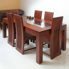 a wooden table with six chairs around it