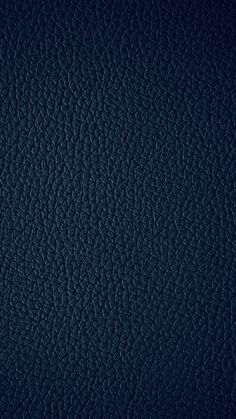 a dark blue leather texture background or wallpaper that looks like it has been painted