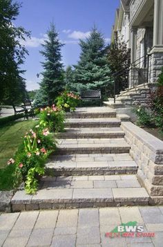 stone steps lead up the side of a house