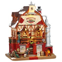 a small building with lights and decorations on the front is made out of lego bricks