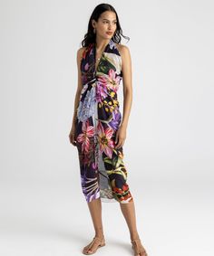 Go beyond the beach with this investment-worthy style in a stunning botanic print and elevated fabric that drapes beautifully! A sarong scarf (also known as a pareo) is a classic summer cover-up that is the epitome of versatility. Worn casual or chic, this beach-ready essential can be a dress, a skirt, or a scarf. Dimensions: 42" x 70" Materials: 80% cotton / 20% silk Made in: India ​ Elegant Spring Vacation Sarong, Spring Tropical Floral Print Sarong, Spring Floral Print Sarong For Poolside, Spring Floral Print Sarong For Beach Cover-up, Spring Floral Print Sarong For Beach, Floral Print Sarong For Spring Beach Cover-up, Scarf Dimensions, Summer Cover Up, Beach Ready