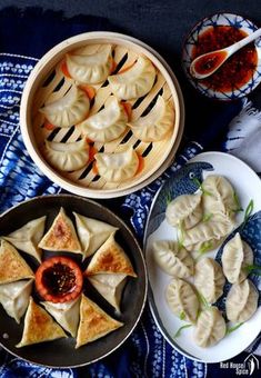 some dumplings and other food items on a table