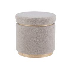 a round stool with a gold rim on the bottom and a gray seat cushion in front