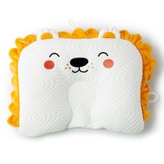 a white and yellow pillow with an animal face on it's side, sitting in front of a white background