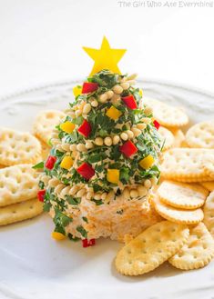 a christmas tree made out of crackers on a plate