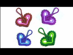 four small crocheted hearts are shown in different colors