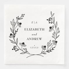 a black and white photo with the words elizabeth and andrew written in floral wreaths