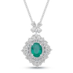 This stunning emerald and diamond necklace boasts a 8x6mm mesmerizing emerald surrounded by a symphony of natural diamonds. A perfect statement piece for the discerning woman. SKU BS30785P EMERALD SIZE 8x6mm COLORSTONE SHAPE Oval COLORSTONE WT 2.22cts DIAMOND WT 1.14cts Ethically sourced emeralds directly from our renowned Belmont mine in Brazil. Oval Emerald Necklace With Diamond Accents For Formal Occasions, Formal Oval Emerald Necklace With Diamond Accents, Oval Emerald Necklace With Diamond Accents, Formal Oval Emerald Necklace With Diamond, Emerald Necklace With Diamond Oval Pendant, Fine Jewelry, Fine Jewelry Emerald Necklace With Oval Diamond Pendant, Fine Jewelry Diamond Emerald Necklace With Oval Pendant, Formal Emerald Oval Pendant Necklace, Formal Green Oval Diamond Necklace