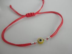 All you need to be protected against the evil eye. This little eyes are about 6mm and the bracelets are adjustable for a perfect fit. This listing is for ONE bracelet, you can choose the eye color and the cord color. eye colors are: blue, red, yellow, green and purple. cord colors are: red, white, gray, black, pink, brown, navy, purple, light blue, green neon, hot pink neon... If you prefer them with a CLASP follow this link: https://www.etsy.com/listing/89266477/evil-eye-bracelet -------------- Adjustable Round Evil Eye Bracelet, Adjustable Evil Eye Bracelet For Friendship, Adjustable Evil Eye Friendship Bracelets, Adjustable Evil Eye Friendship Bracelet, Casual Adjustable Evil Eye Bracelet As Gift, Adjustable Red Evil Eye Friendship Bracelets, Casual Evil Eye Friendship Bracelets As Gift, Casual Evil Eye Friendship Bracelets For Gifts, Red Evil Eye Friendship Bracelet