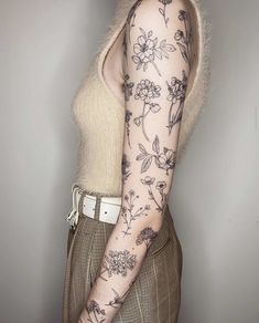 a woman with a tattoo on her arm