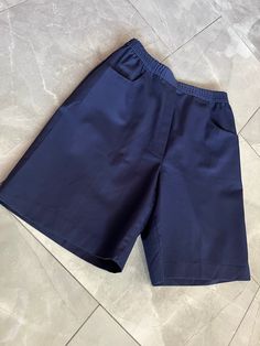 "Vintage navy blue military style shorts made by Traditions. Elastic waist, faux fly with pockets. Tagged as a size 12, measures 13\" across waist, 21\" hips, 13\" rise, 20\" long." Navy Shorts With Pockets For Summer, Navy Shorts With Pockets For Work, Navy Bottoms With Pockets, Solid Bermuda Shorts With Side Pockets, Bermuda Shorts With Side Pockets, Summer School Bottoms, Bermuda Workwear Shorts With Pockets, Cargo Shorts With Side Pockets For Work, Short Cargo Shorts With Side Pockets For Work