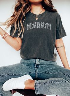 Mississippi Tee, College Style Tee, Mississippi State Souvenir. 100% Cotton, Authentic COMFORT COLORS T-Shirt, Premium Quality Fabric, Printed in the USA Direct on Garment Printing using Water Based Eco-friendly Inks. Unisex Sizing, Relaxed Fit For Women.  Go 1-2 sizes up for the oversized look On White and Ivory colors we print black text. You can compare one of your tees to the sizing chart available in our listing photos. Colors might be look a bit different on different screens, the design i Casual Gray T-shirt For College, Gray Cotton T-shirt With School Spirit, School Spirit T-shirt With Text Print For Everyday, College Style Short Sleeve Top With Screen Print, Relaxed Fit Short Sleeve Top For School Spirit, Soft-washed Cotton T-shirt For Fan Apparel, Soft-washed Cotton T-shirt For Fans, Soft-washed Relaxed Fit Tops For Fans, Crew Neck Top With Screen Print For College