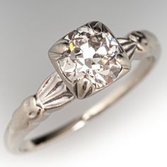 an antique diamond ring is shown on a white background