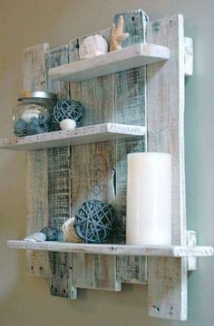 two wooden shelves holding candles and other items