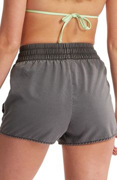 An easy-fitting shirred drawstring waist tops these swim shorts offering sporty style that's comfy on land and in the water. 2" inseam; 26" leg opening; 13" front rise; 17" back rise (size Medium) 100% polyester Machine wash, tumble dry Imported Poolside Shorts With Elastic Waistband, Short Bottoms With Elastic Waistband For Poolside, Athleisure Pajama Shorts With Elastic Waistband For Vacation, Summer Vacation Activewear With Elastic Waistband, Sporty High-waisted Pajama Shorts For Vacation, Sporty Relaxed Fit Pajama Shorts For Beach Season, Athleisure Athletic Shorts For Vacation With Relaxed Fit, Athleisure Relaxed Fit Athletic Shorts For Vacation, Relaxed Fit Athleisure Athletic Shorts For Vacation