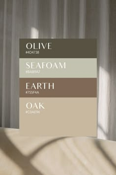 the color scheme for olive and seafoam is shown in shades of earth, oak, white, and gray