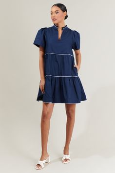 The Candace Tiered Mini Dress will be your favorite pick! This mini dress has a split neckline followed by a ruffle mock neck and short puff sleeves. It has two tier layers and a loose fit. Dress it up with heels or with sneakers for a more casual look. - Split neckline- Ruffle trim- Puffed short sleeves- Pockets- Comes in 3 colorsSize + Fit - Model is 5'8" and wearing size XS- Measurements taken from size S - Chest: 19 3/4"- Length: 35" Fabric Self:100% Cotton Contrast:100% Cotton Lining:97% Po Mock Neck Dress, 80 Dress, Red Mini Dress, Ruffle Trim, Mock Neck, Sewing Dresses, Puff Sleeve, Casual Looks, New Dress