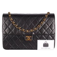 Authentic Chanel front flap bag with quilted calfskin leather. Features black quilted calfskin leather, this luxurious, runway-ready bag features woven-in felt chain strap and 24kt gold plated hardware accents. Its CC snap closure opens to a leather-lined interior with a zip pocket. This Chanel bag is the perfect size for all your essentials. Carry your wallet, cosmetics, cell phone, and more. You're going to love this bag! Ultra rare classic Chanel investment piece. Hologram sticker reads: 4869 Luxury Quilted Flap Bag, Classic Quilted Flap Bag For Evening, Classic Quilted Evening Flap Bag, Formal Quilted Double Flap Bag, Designer Quilted Flap Bag For Business, Elegant Quilted Flap Bag For Business, Luxury Quilted Double Flap Bag, Luxury Quilted Flap Bag For Business, Formal Quilted Rectangular Flap Bag