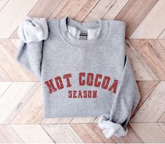 It's hot cocoa season! Our cute holiday sweatshirts are so comfy and cozy. They're soft, heavy and warm which makes them perfect for winter. These sweatshirts make a great gift for friends and family and anyone who loves hot chocolate, the holidays and the winter season. 50% polyester, 50% cotton Warm and cozy Fits true to size For an oversized look, we recommend ordering up a size or two depending on how big you like it! These shirts are made to order. Unfortunately, we are unable to speed up production times. It may be possible to expedite shipping only for an additional fee. Please message us for more information. Since all of our shirts are made to order, we do not accept returns. However, your satisfaction is incredibly important to us. If you experience any issues with your purchase, Fall Hot Chocolate, V Neck Shirts, Feminist Gift, Round Neck Shirt, American Flag Shirt, Holiday Sweatshirt, Emergency Room, Winter Sweatshirt, Women Supporting Women